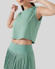 Side view of teal cropped active tank