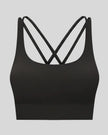 3D product view of the AlignCross Studio Bra in black, highlighting the scoop neckline and crisscross back straps.