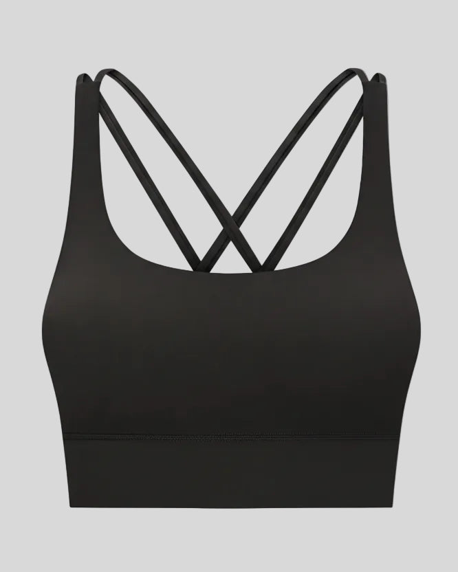3D product view of the AlignCross Studio Bra in black, highlighting the scoop neckline and crisscross back straps.