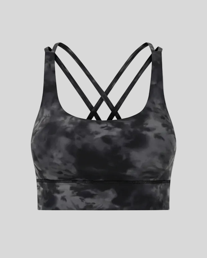 3D product view of the AlignCross Studio Bra in dark gray, highlighting the scoop neckline and crisscross back straps.