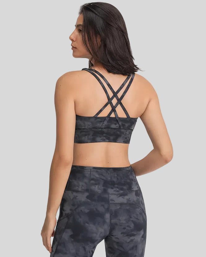 Back view of the AlignCross Studio Bra in dark gray, highlighting the crisscross strap design.