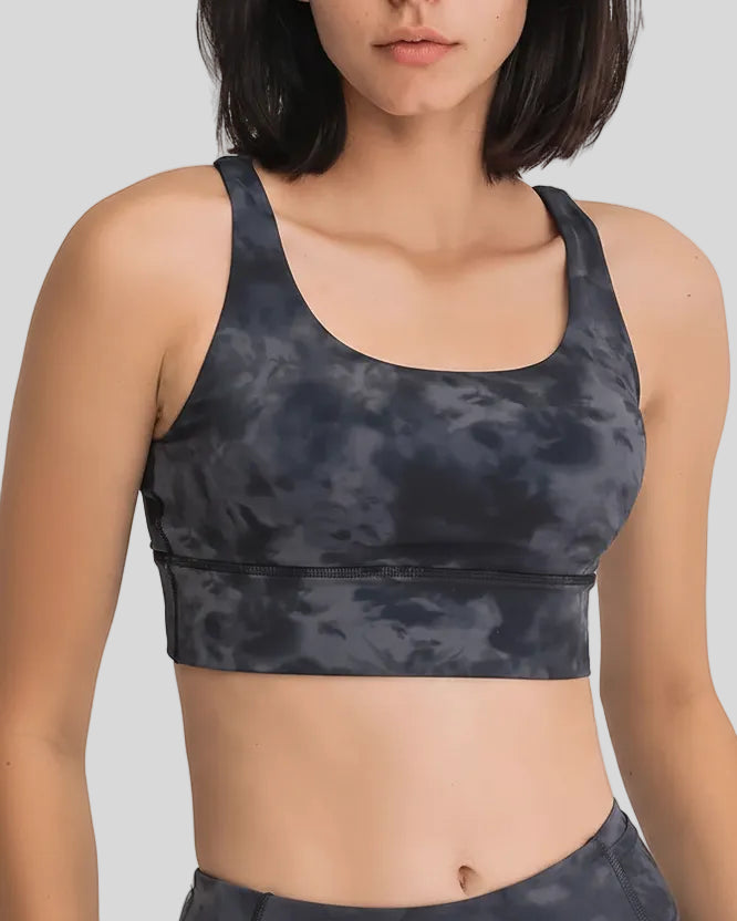 AlignCross Studio Bra in dark gray worn by model, featuring a scoop neckline and soft supportive fit.