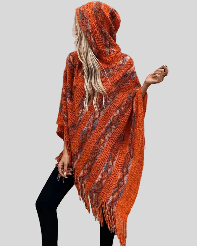 Angled front view of AccentFlow Fringe Hooded Poncho in terracota with hood on