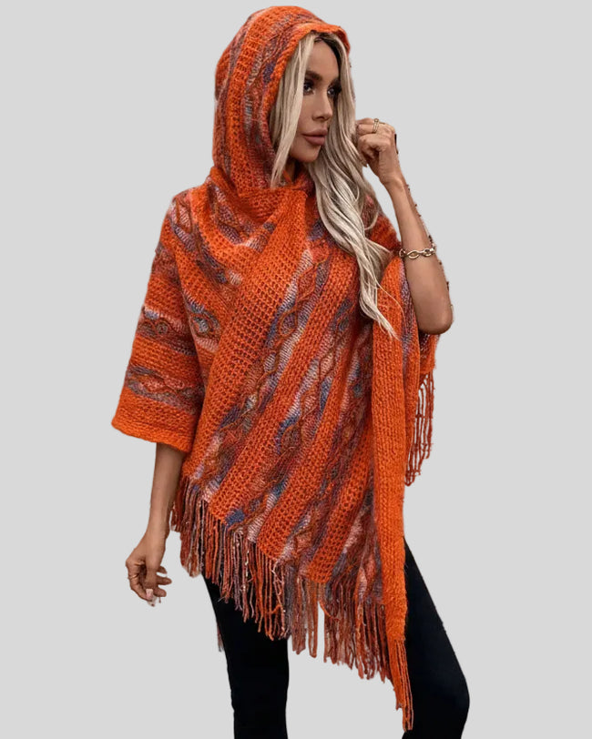 Front view of AccentFlow Fringe Hooded Poncho in terracota with hood worn up