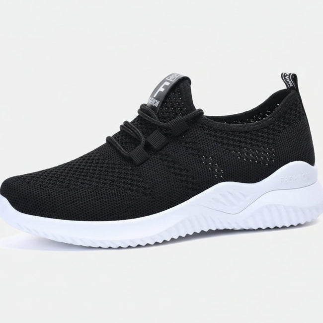 Black mesh sneaker side view with breathable mesh upper and flexible sole