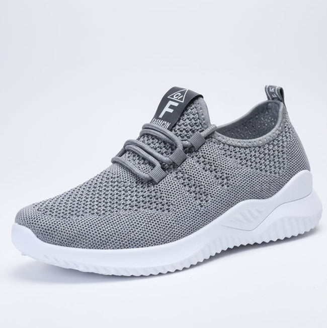Gray mesh sneaker side view with breathable mesh upper and flexible sole