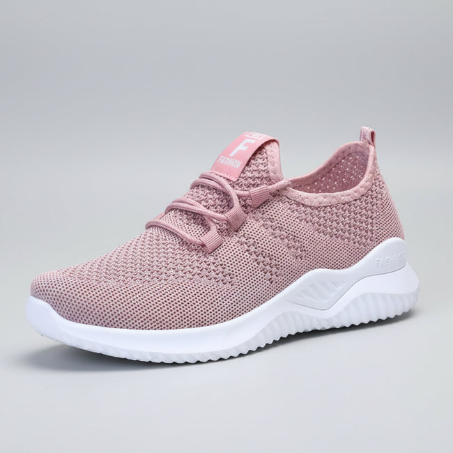 Pink mesh sneaker side view with breathable mesh upper and flexible sole