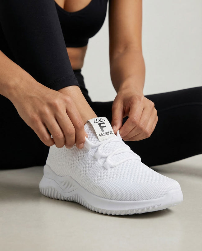 Woman adjusting mesh sneaker showing fit and breathable mesh upper detail