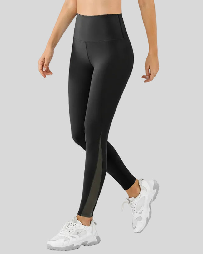 Left side view of black AeroFlow mesh legging featuring lightweight mesh detailing