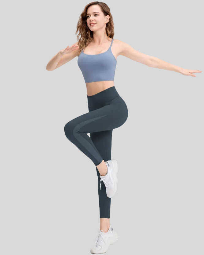 Full body front angle view of AeroFlow mesh legging in dark gray with breathable side panels