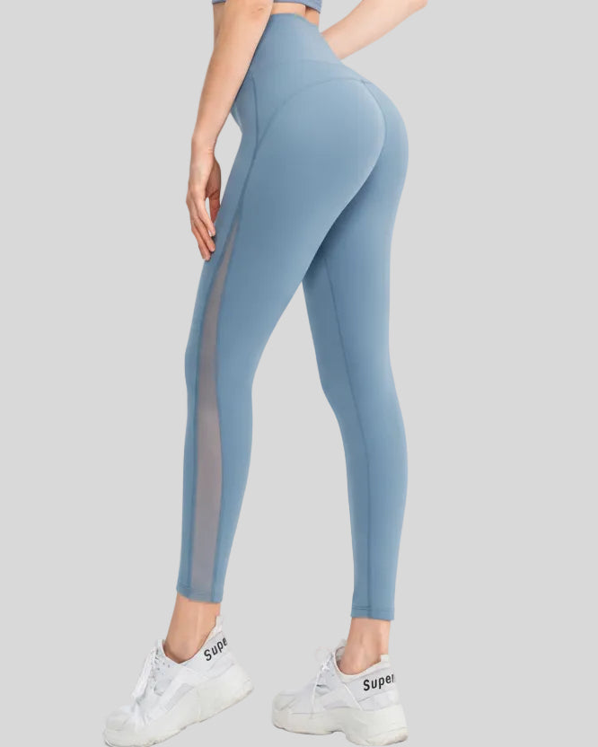 Back angle view of AeroFlow mesh legging in light blue highlighting airflow mesh details