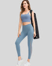 Full body front angle view of AeroFlow mesh legging in light blue with breathable side panels