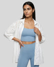 Aira Eyelet Shirt styled as a lightweight layer in white, worn oversized for an effortless elevated look