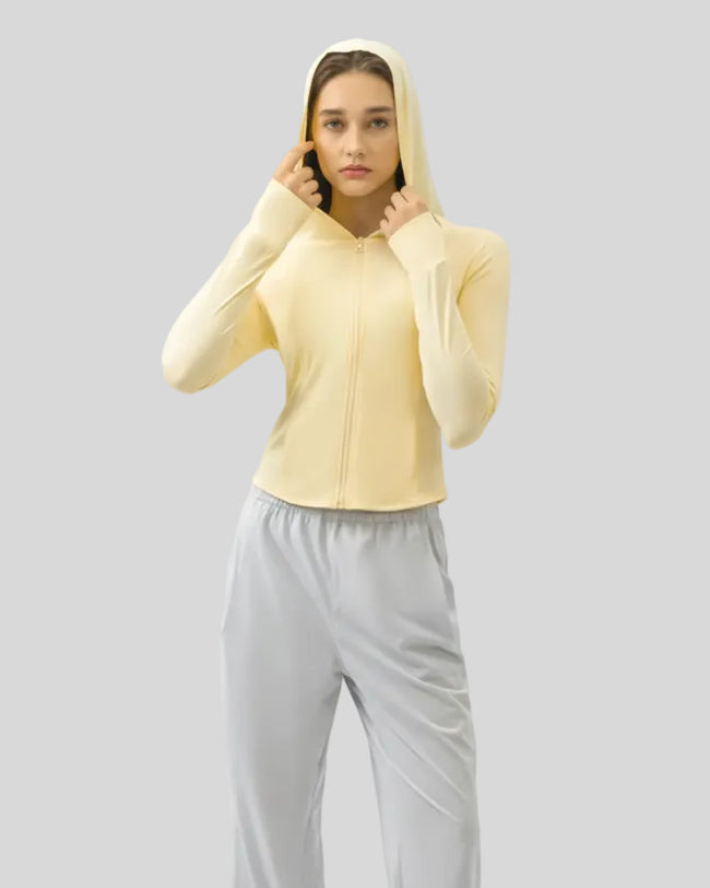 Light yellow lightweight active hoodie worn with hood up, front view