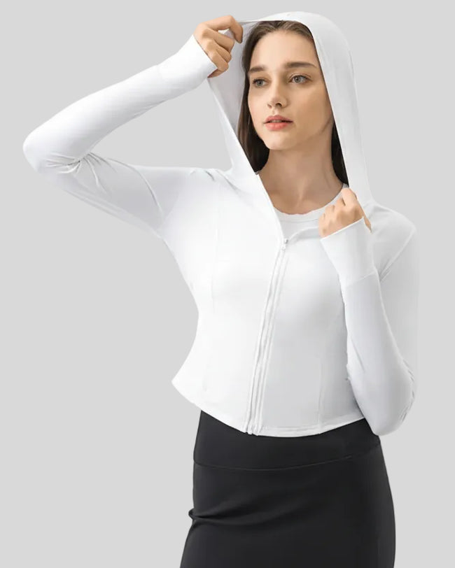 Close-up of white zip-up active hoodie fabric and front zipper detail