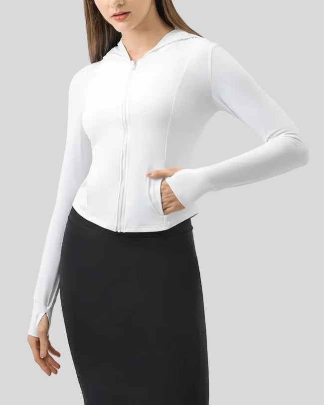 White zip-up active hoodie showing fitted silhouette and front pockets