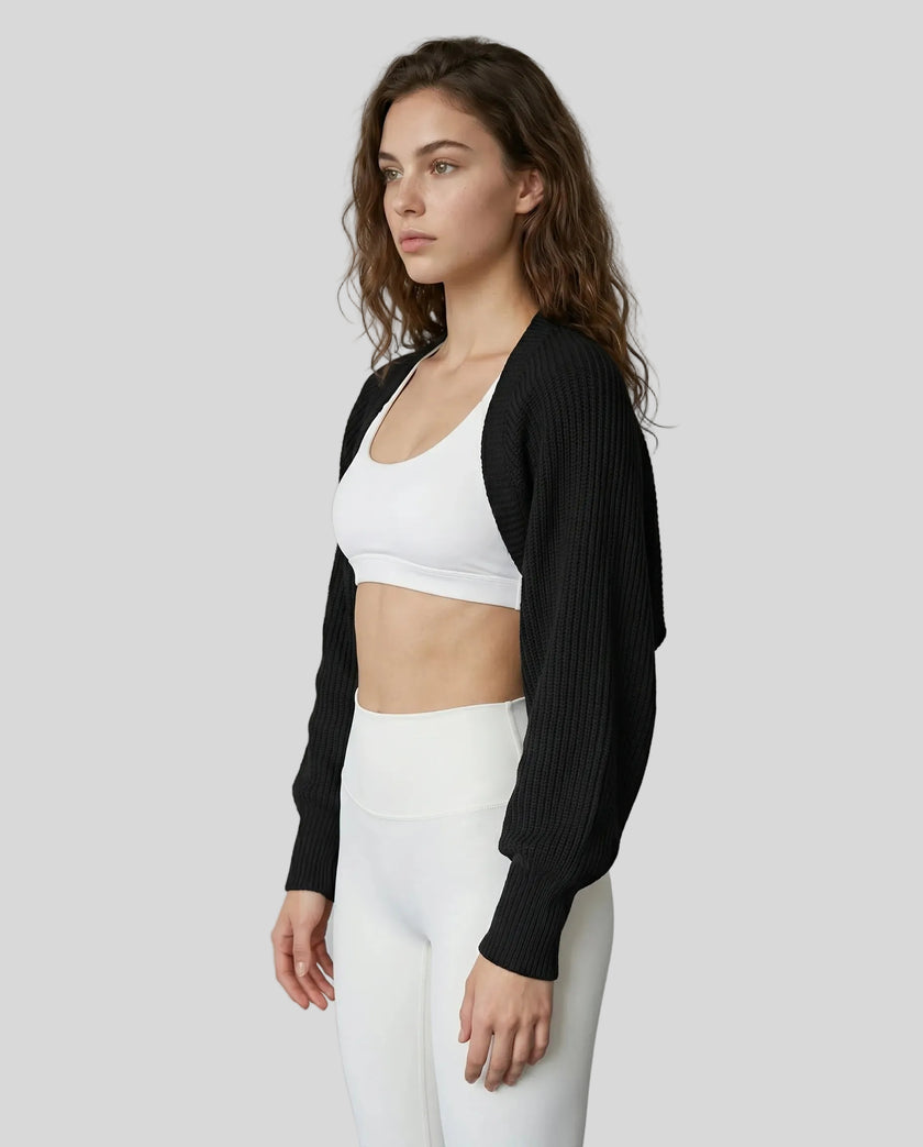 Side view of model wearing AirLoom Knit Shrug in black