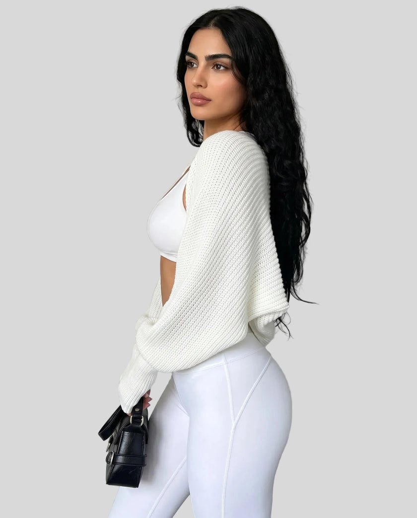 Side view of model wearing AirLoom Knit Shrug in white