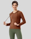 Front angle view of brown zip-up active hoodie fabric and drawstring detail