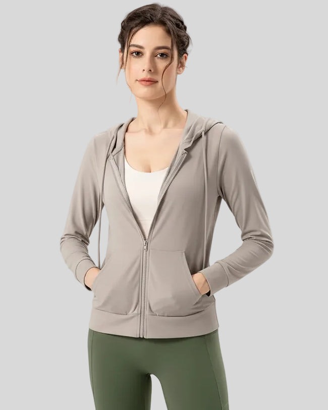 Tan active hoodie worn with half zip down, front view