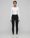 Athlesi AlignForm leggings black color styled on model with activewear top in minimal setting