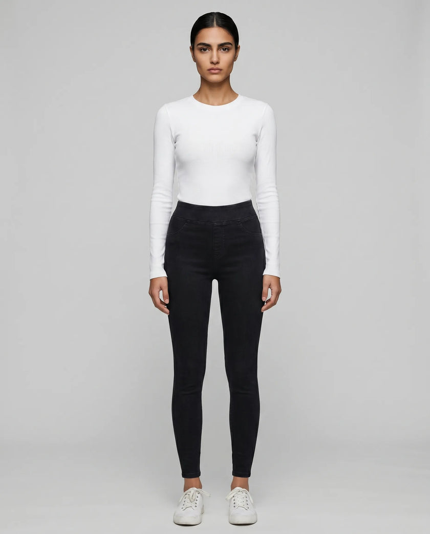 Athlesi AlignForm leggings black color styled on model with activewear top in minimal setting