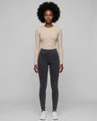 Athlesi AlignForm leggings charcoal color styled on model with activewear top in minimal setting