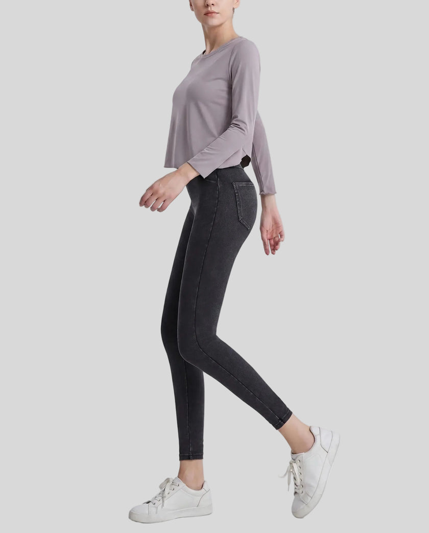Model wearing Athlesi AlignForm leggings in charcoal color side view showing contouring fit and seamless design