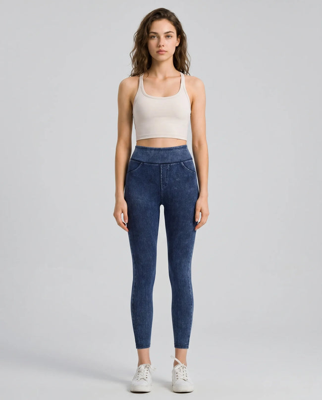 Athlesi AlignForm leggings dark color styled on model with activewear top in minimal setting