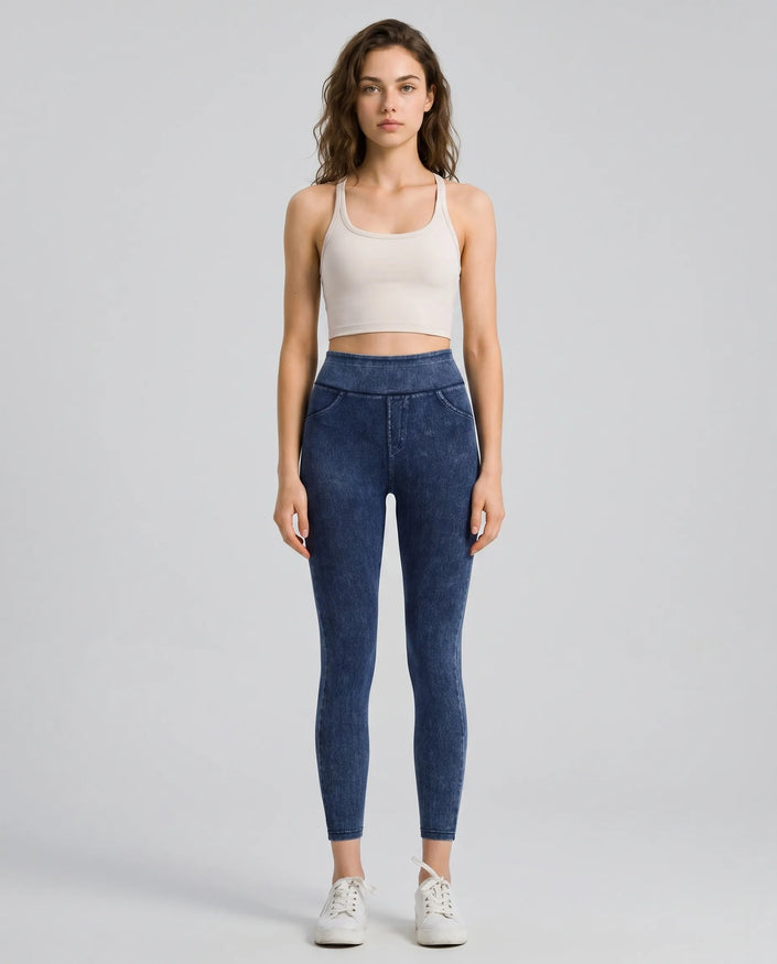Athlesi AlignForm leggings dark color styled on model with activewear top in minimal setting