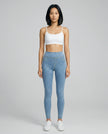 Athlesi AlignForm leggings light color styled on model with activewear top in minimal setting