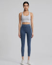Athlesi AlignForm leggings medium color styled on model with activewear top in minimal setting