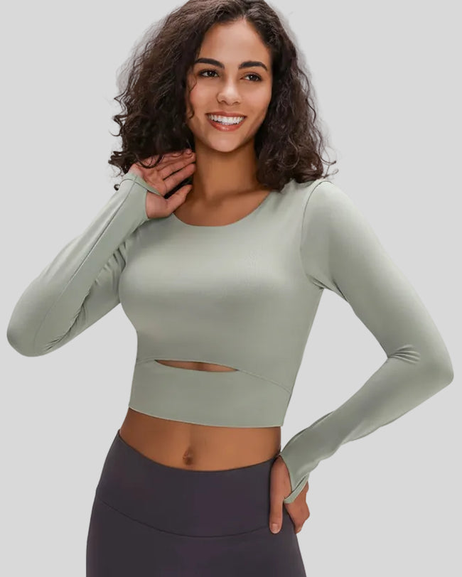 Angled front view of Athlesi AlignLift Studio long sleeve top in sage