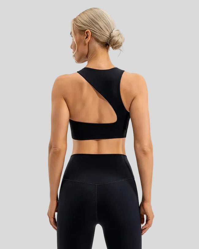 Back view of ArcFlow Sports Bra in black showing signature open-back cutout design