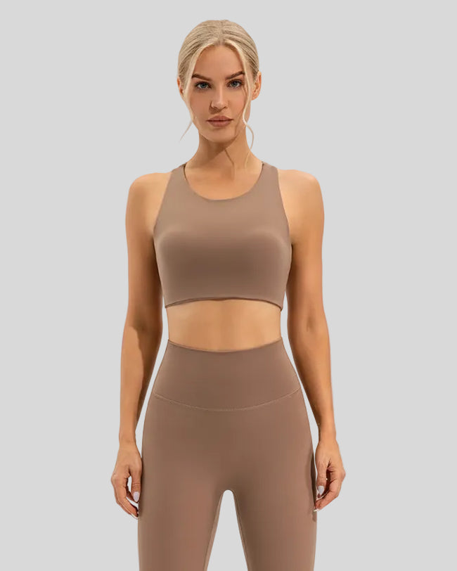 Athlesi ArcFlow Sports Bra camel paired with high-waist leggings