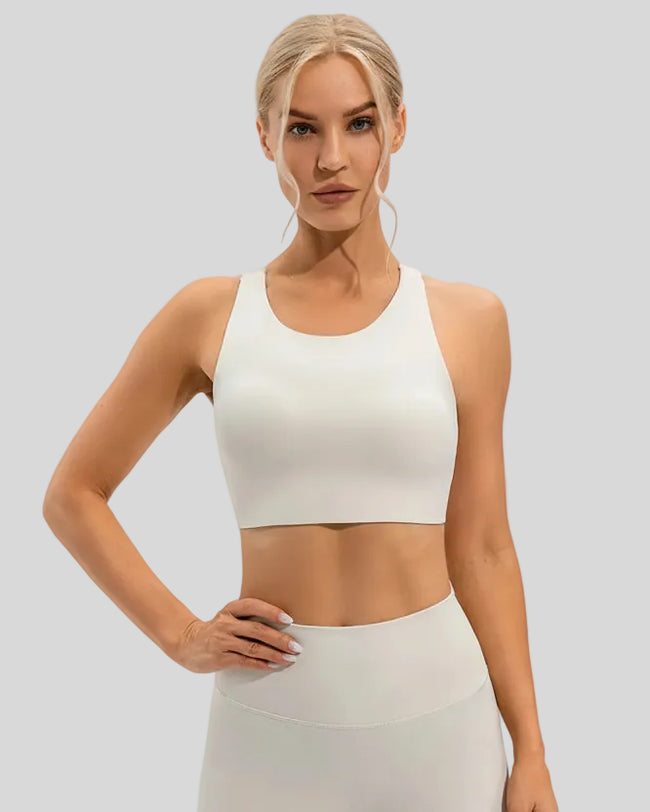 Front view of Athlesi ArcFlow Sports Bra in white highlighting smooth cropped fit