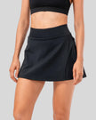 High-rise pleated sports skirt in black with flowy movement and clean structure