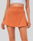 High-rise pleated active skirt in caramel with smooth waistband and lightweight performance fabric
