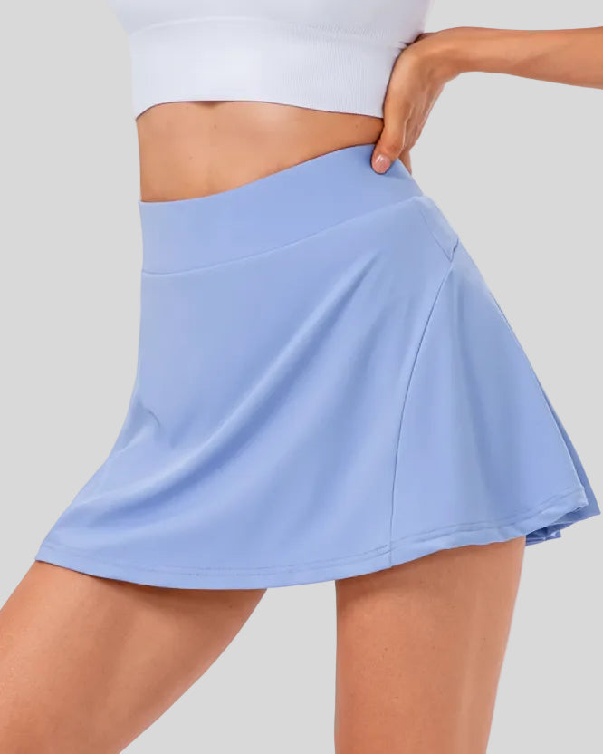 High-rise pleated sports skirt in light blue with flowy movement and clean structure