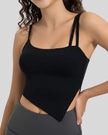 Angled view of AsymFlow Edge Active Cami in black, showing asymmetrical cut and soft stretch fabric