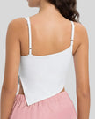 Back view of white AsymFlow Edge Active Cami with clean straps and smooth opaque finish
