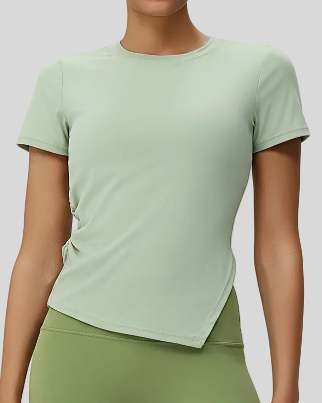 AsymFlow short sleeve active top in avocado green with relaxed fit and round neckline