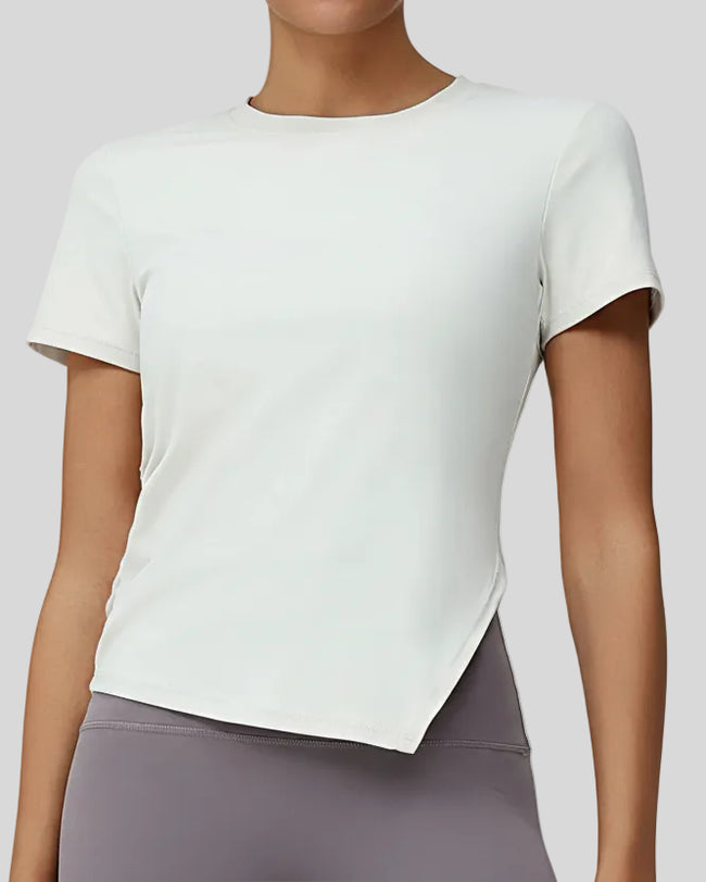 AsymFlow short sleeve active top in white with relaxed fit and round neckline