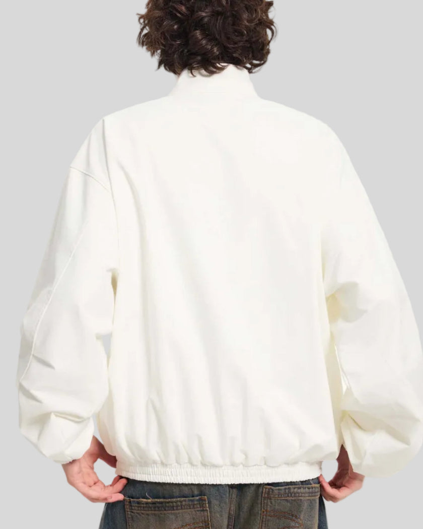 Upper body back view of man wearing Axis Bomber Jacket in Beige
