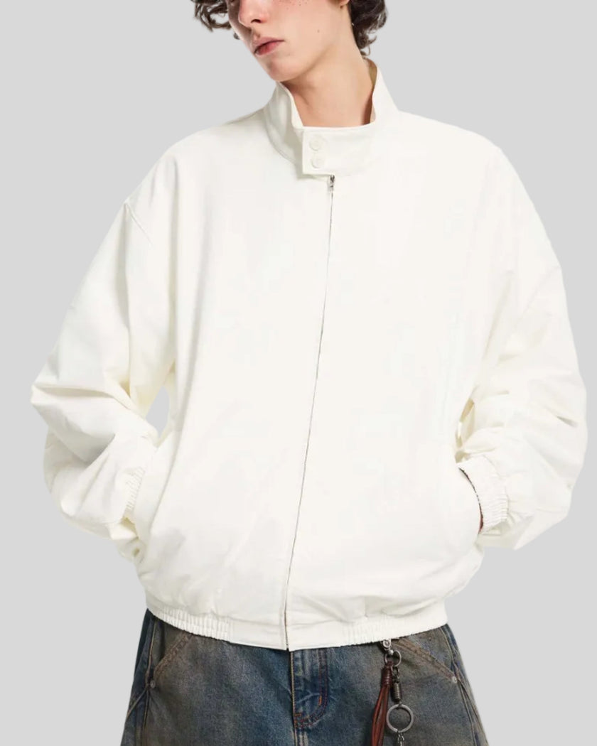 Upper body front angle view of man wearing Axis Bomber Jacket in Beige