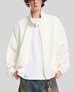 Upper body front view of man wearing Axis Bomber Jacket in Beige