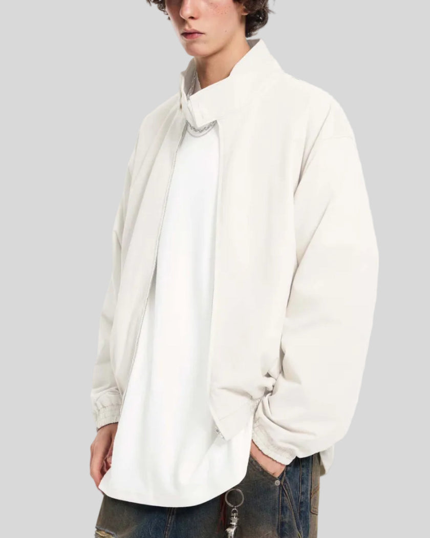Upper body side angle view of man wearing Axis Bomber Jacket in Beige