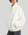 Upper body side view of man wearing Axis Bomber Jacket in Beige
