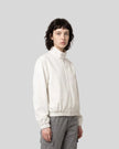 Upper body front view of woman wearing Axis Bomber Jacket in Beige
