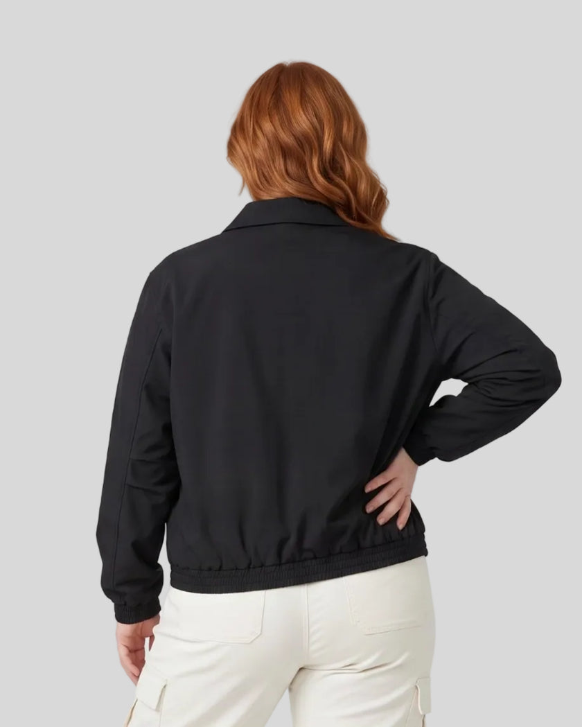 Upper body back view of woman wearing Axis Bomber Jacket in Black